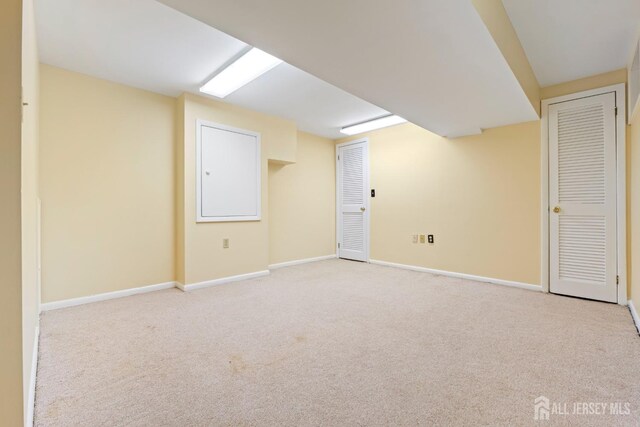 finished basement with carpet flooring and baseboards