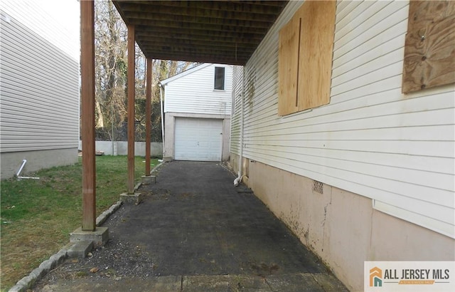 36 Cliffwood Way S, Amboy, NJ 08879 - view of side of property with asphalt driveway, an attached garage, and a yard