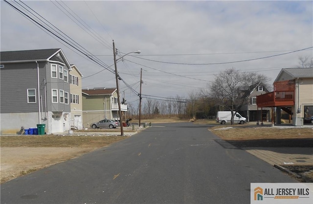 36 Cliffwood Way S, Amboy, NJ 08879 - view of asphalt road with street lights and a residential view