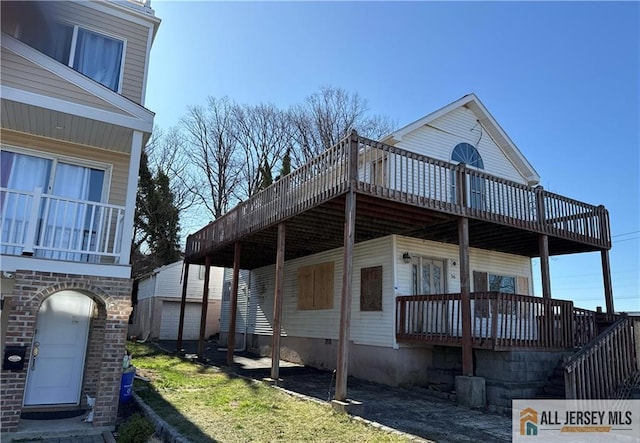 36 Cliffwood Way S, Amboy, NJ 08879 - view of side of home with a wooden deck, an outdoor structure, and a lawn