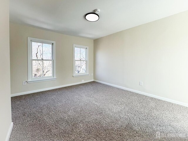 empty room featuring carpet flooring