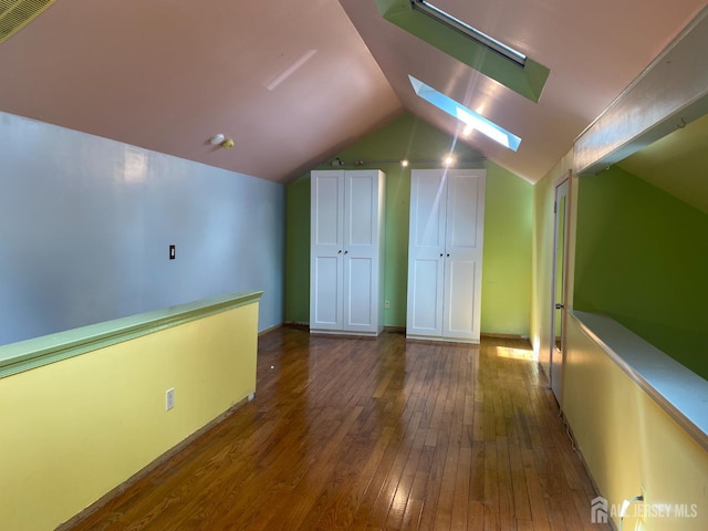112 Beverly Hill Ter Unit H, Woodbridge Proper, NJ 07095 - additional living space featuring hardwood / wood-style floors, a skylight, and vaulted ceiling