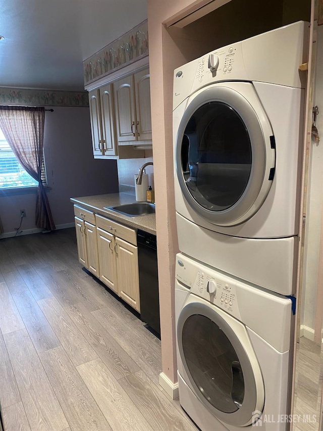 112 Beverly Hill Ter Unit H, Woodbridge Proper, NJ 07095 - washroom with stacked washer / dryer and light wood-style floors