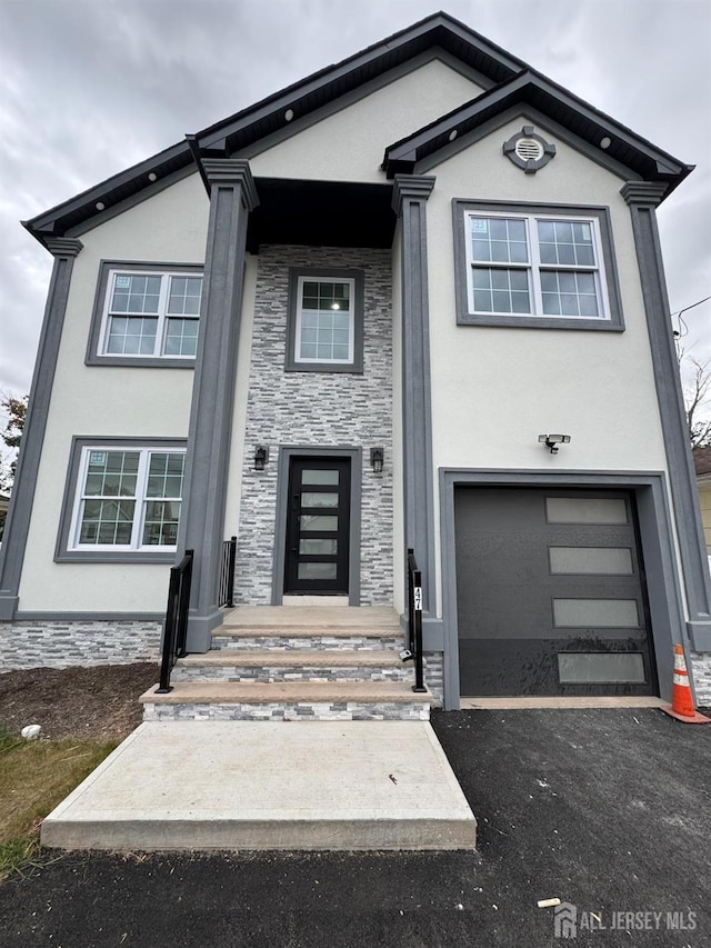 view of front of property featuring a garage