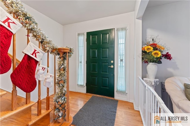 foyer entrance with light hardwood / wood-style flooring