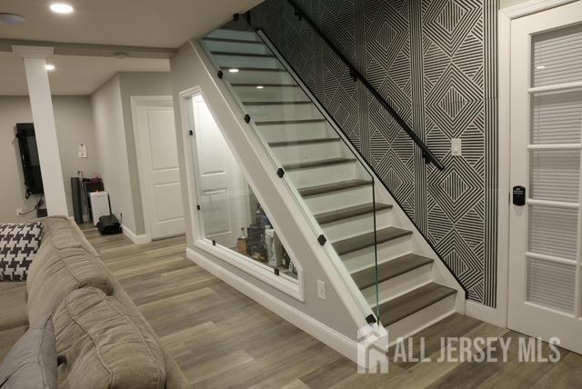 staircase featuring hardwood / wood-style flooring