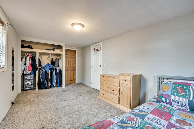 carpeted bedroom with a closet