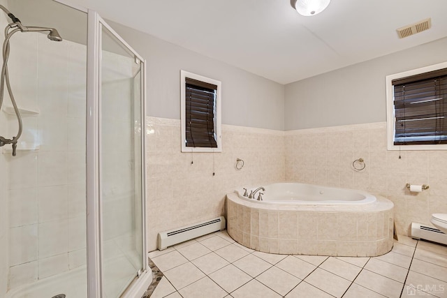 bathroom featuring tile walls, tile patterned flooring, a baseboard radiator, and shower with separate bathtub