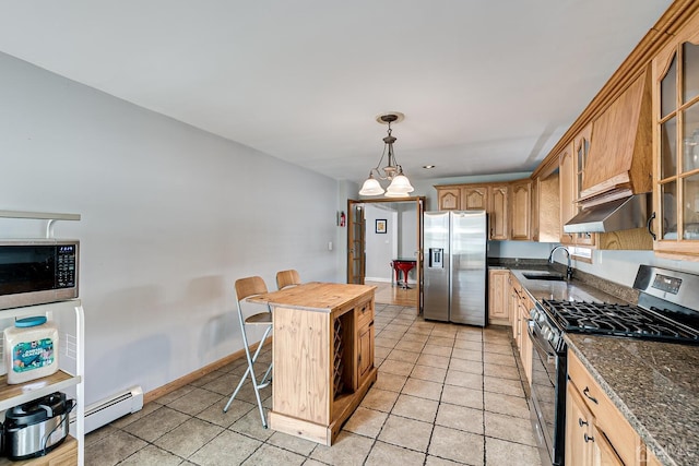 kitchen featuring sink, light tile patterned floors, appliances with stainless steel finishes, a kitchen island, and a chandelier