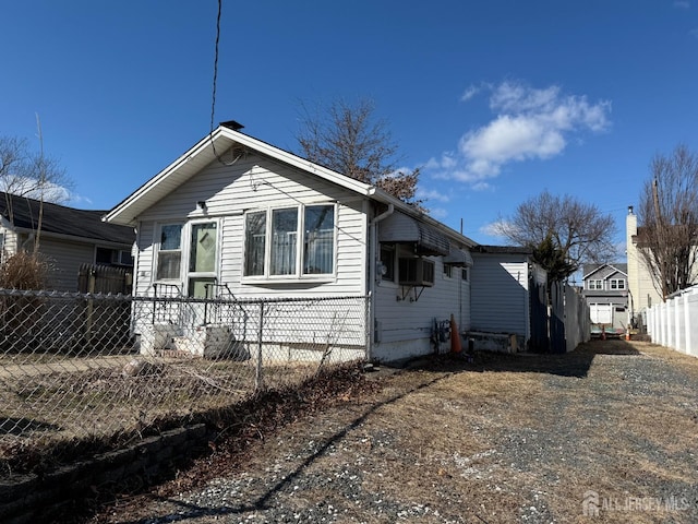 view of front of home featuring fence