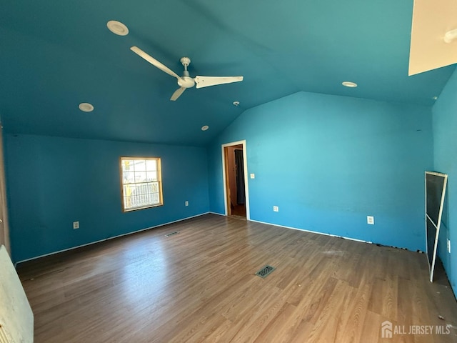 interior space featuring vaulted ceiling, ceiling fan, and wood finished floors