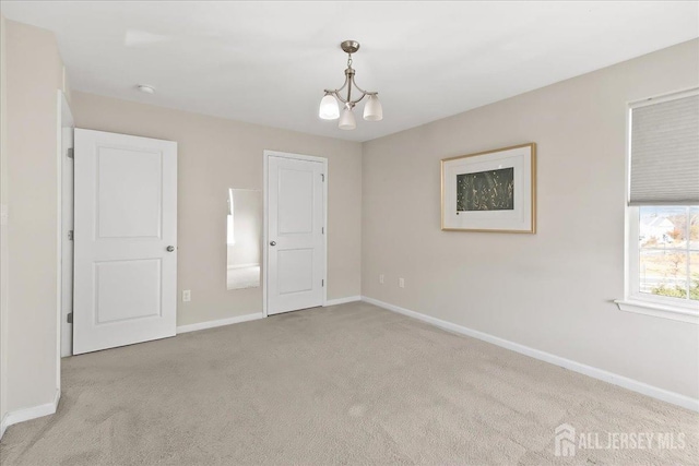 905 Chalmers Ln, Monroe, NJ 08831 - unfurnished bedroom featuring carpet flooring and a chandelier