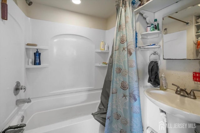 bathroom featuring sink and shower / tub combo