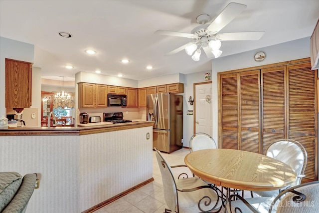 97 Fairway Blvd, Monroe, NJ 08831 - kitchen with black appliances, light tile patterned floors, recessed lighting, a ceiling fan, and a peninsula