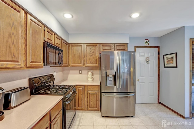 97 Fairway Blvd, Monroe, NJ 08831 - kitchen featuring black appliances, light countertops, light tile patterned floors, brown cabinetry, and recessed lighting