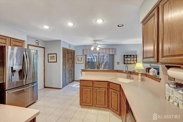 97 Fairway Blvd, Monroe, NJ 08831 - kitchen with stainless steel fridge with ice dispenser, a peninsula, brown cabinets, light countertops, and recessed lighting