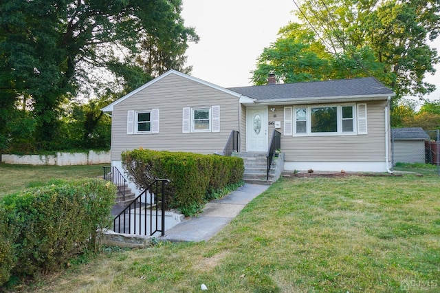 view of front of home with a front lawn