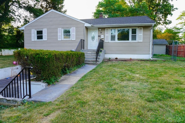 view of front of house with a front lawn