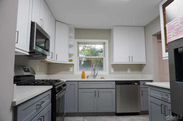 66 Willow Ave, Iselin, NJ 08830 - kitchen featuring stainless steel appliances, a sink, gray cabinets, and light countertops