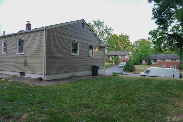 66 Willow Ave, Iselin, NJ 08830 - view of side of home featuring a chimney and a yard