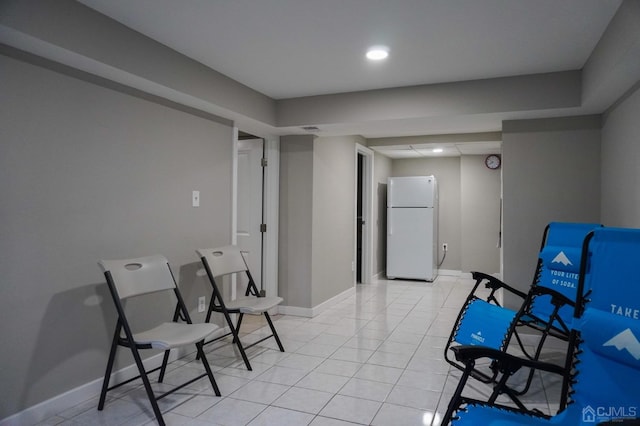 sitting room with light tile patterned floors