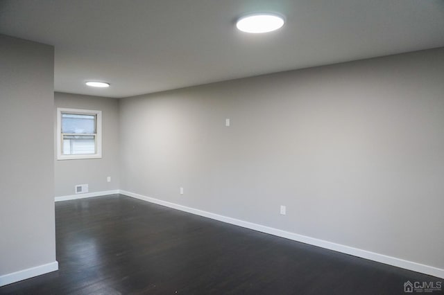 66 Willow Ave, Iselin, NJ 08830 - unfurnished room with baseboards and dark wood finished floors