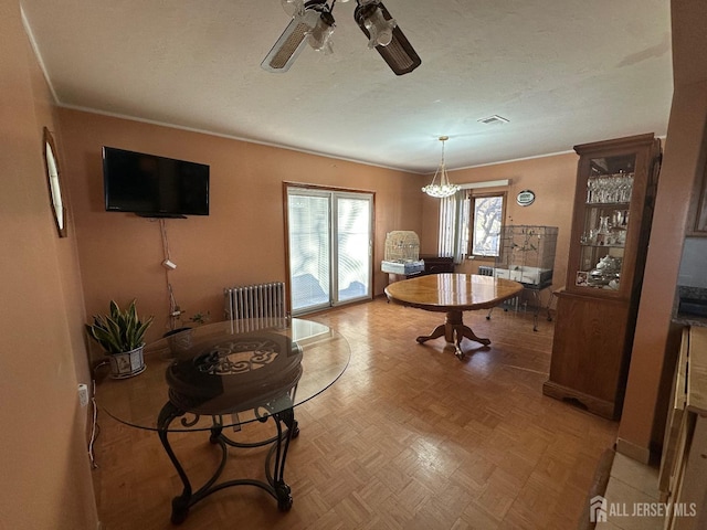 dining room featuring visible vents, a textured ceiling, and ceiling fan