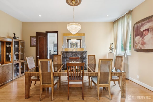 27 Mare Haven Ct, North Brunswick, NJ 08902 - dining area with a chandelier, wood finished floors, and recessed lighting