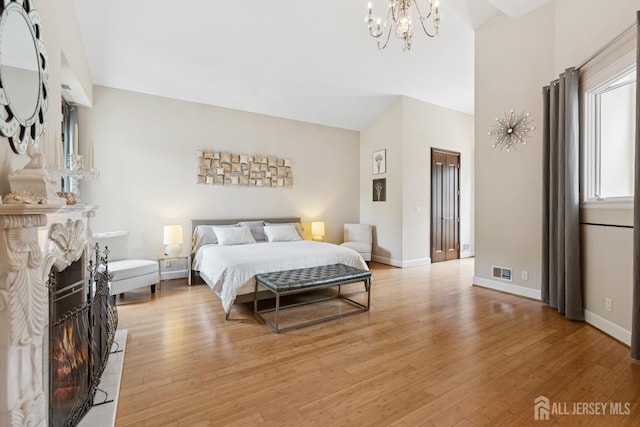 27 Mare Haven Ct, North Brunswick, NJ 08902 - bedroom with light wood-type flooring, a chandelier, and high vaulted ceiling