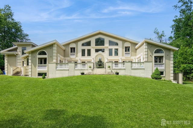 27 Mare Haven Ct, North Brunswick, NJ 08902 - view of front facade featuring stucco siding and a front lawn