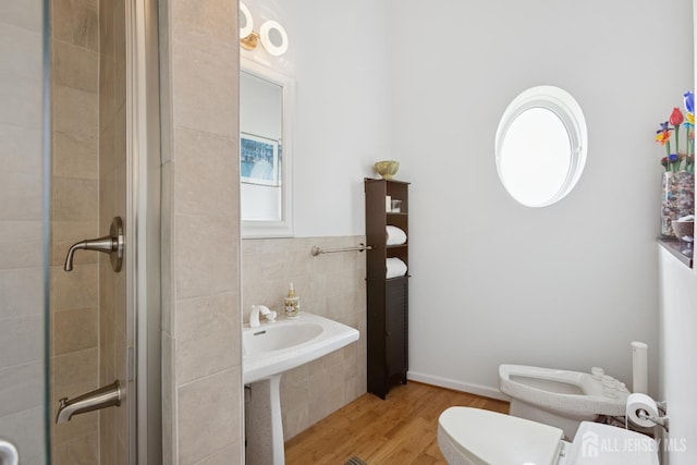 27 Mare Haven Ct, North Brunswick, NJ 08902 - full bathroom featuring wood finished floors, a stall shower, and tile walls