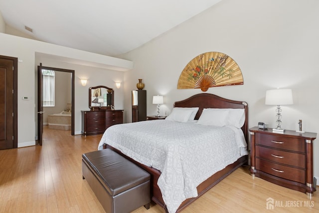 27 Mare Haven Ct, North Brunswick, NJ 08902 - bedroom with vaulted ceiling and light wood-style flooring