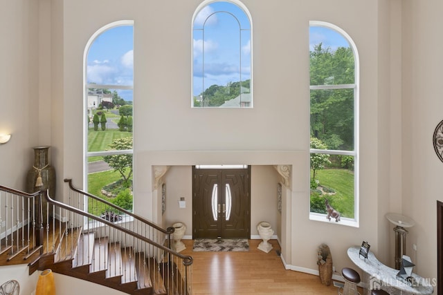 27 Mare Haven Ct, North Brunswick, NJ 08902 - foyer entrance featuring wood finished floors, stairs, and healthy amount of natural light