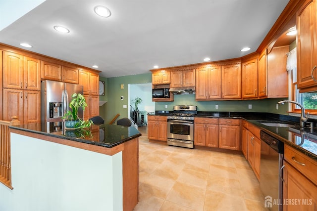 53 Rath Ln, East Brunswick, NJ 08816 - kitchen with stainless steel appliances, recessed lighting, dark stone counters, a center island, and under cabinet range hood