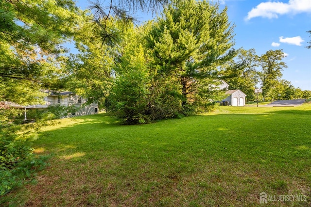53 Rath Ln, East Brunswick, NJ 08816 - view of grassy yard featuring an outdoor structure