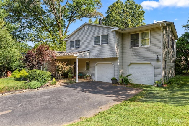 53 Rath Ln, East Brunswick, NJ 08816 - view of front of house featuring a garage, driveway, and a front yard