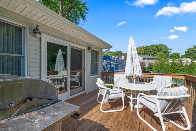 53 Rath Ln, East Brunswick, NJ 08816 - wooden terrace with a grill and outdoor dining space