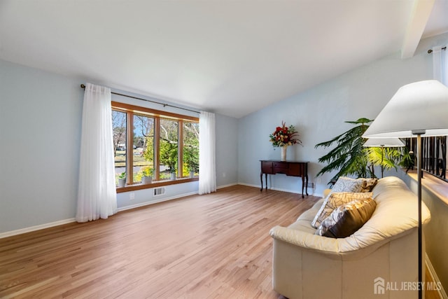 53 Rath Ln, East Brunswick, NJ 08816 - sitting room with vaulted ceiling and light wood finished floors