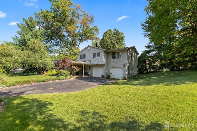 53 Rath Ln, East Brunswick, NJ 08816 - view of front of house with asphalt driveway, a garage, and a front lawn