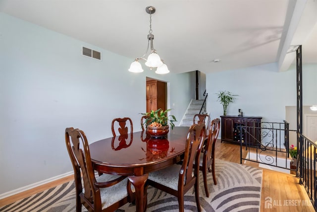 53 Rath Ln, East Brunswick, NJ 08816 - dining area with light wood finished floors and stairway