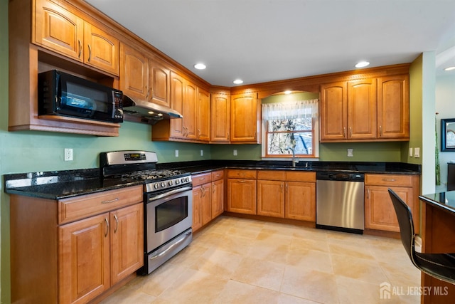 53 Rath Ln, East Brunswick, NJ 08816 - kitchen featuring stainless steel appliances, under cabinet range hood, brown cabinets, dark stone counters, and recessed lighting