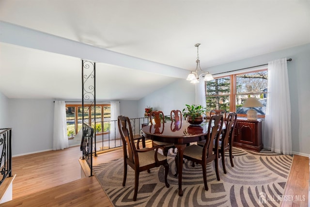 53 Rath Ln, East Brunswick, NJ 08816 - dining space with light wood-style floors, plenty of natural light, and a chandelier
