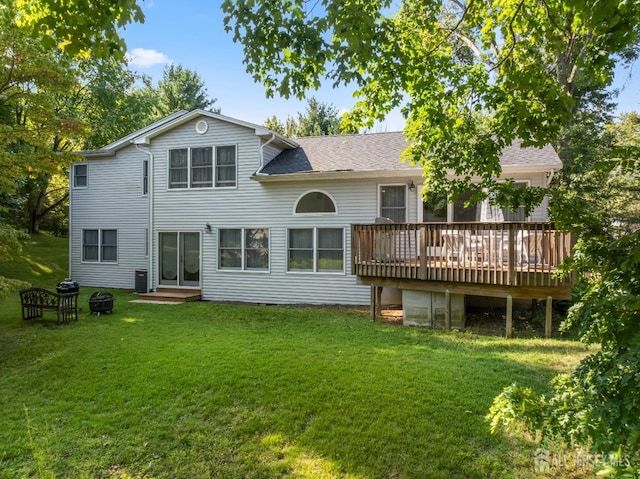 53 Rath Ln, East Brunswick, NJ 08816 - rear view of property with a deck, a yard, an outdoor fire pit, and a shingled roof