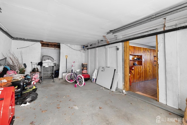 garage featuring wooden walls