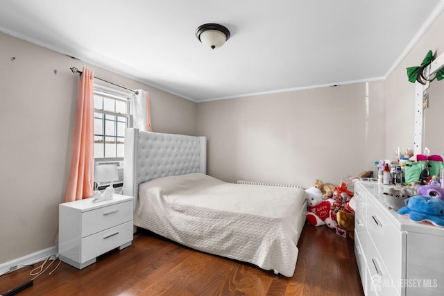 bedroom featuring ornamental molding, wood finished floors, and cooling unit
