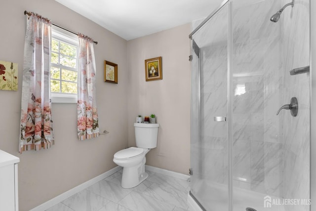 bathroom with a marble finish shower, baseboards, toilet, and marble finish floor