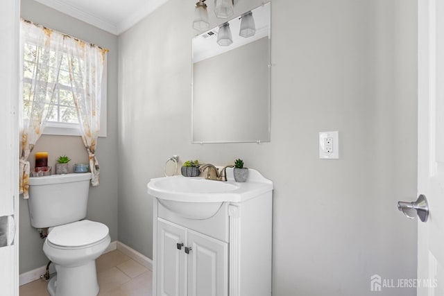half bath with vanity, toilet, tile patterned floors, baseboards, and ornamental molding