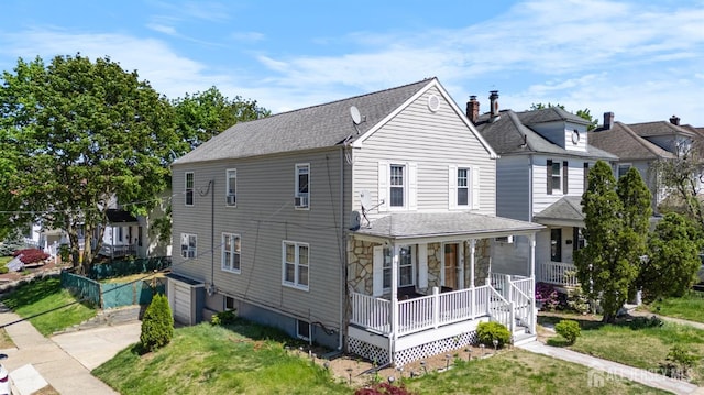 34 James St, Middlesex, NJ 08882 - view of property exterior featuring a porch, driveway, roof with shingles, and a garage