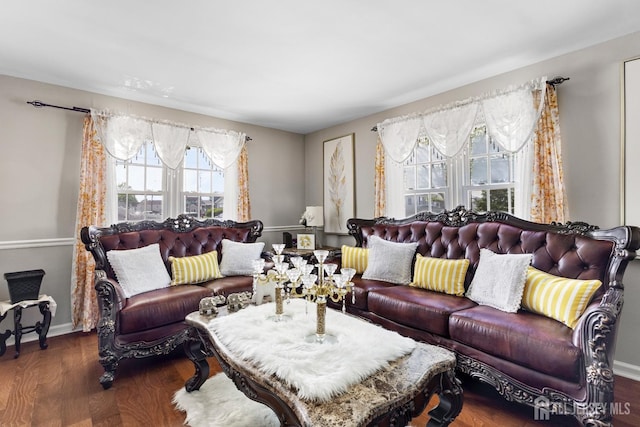 living room with baseboards and wood finished floors