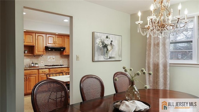 dining room featuring recessed lighting and a notable chandelier